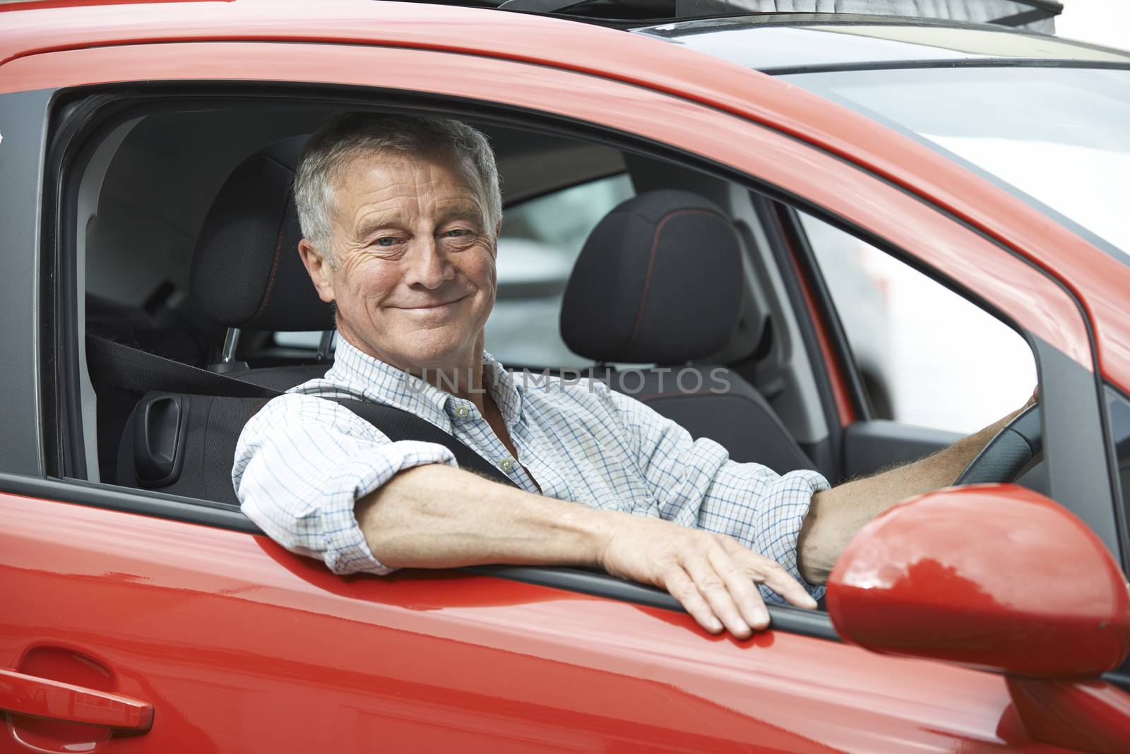 Portrait Of Senior Man Driving Car by HWS