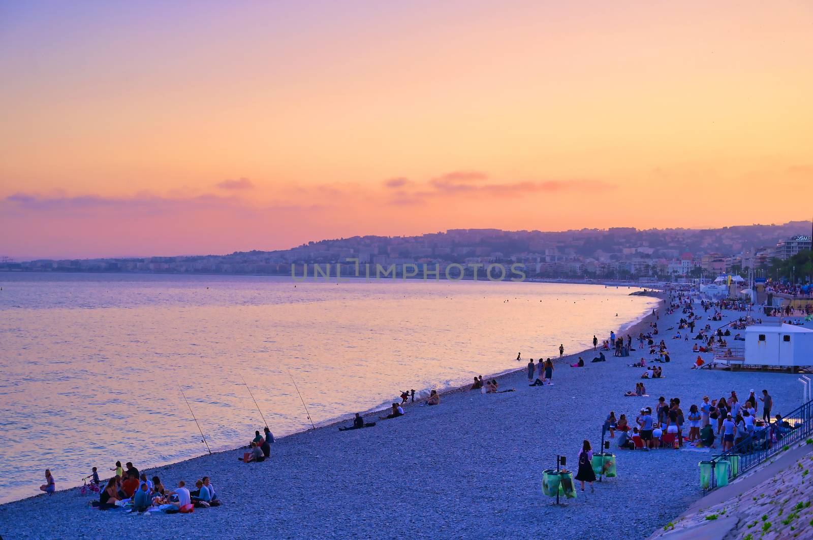 Nice, France - June 8, 2019 - The Promenade des Anglais on the Mediterranean Sea at Nice, France along the French Riviera at sunset.