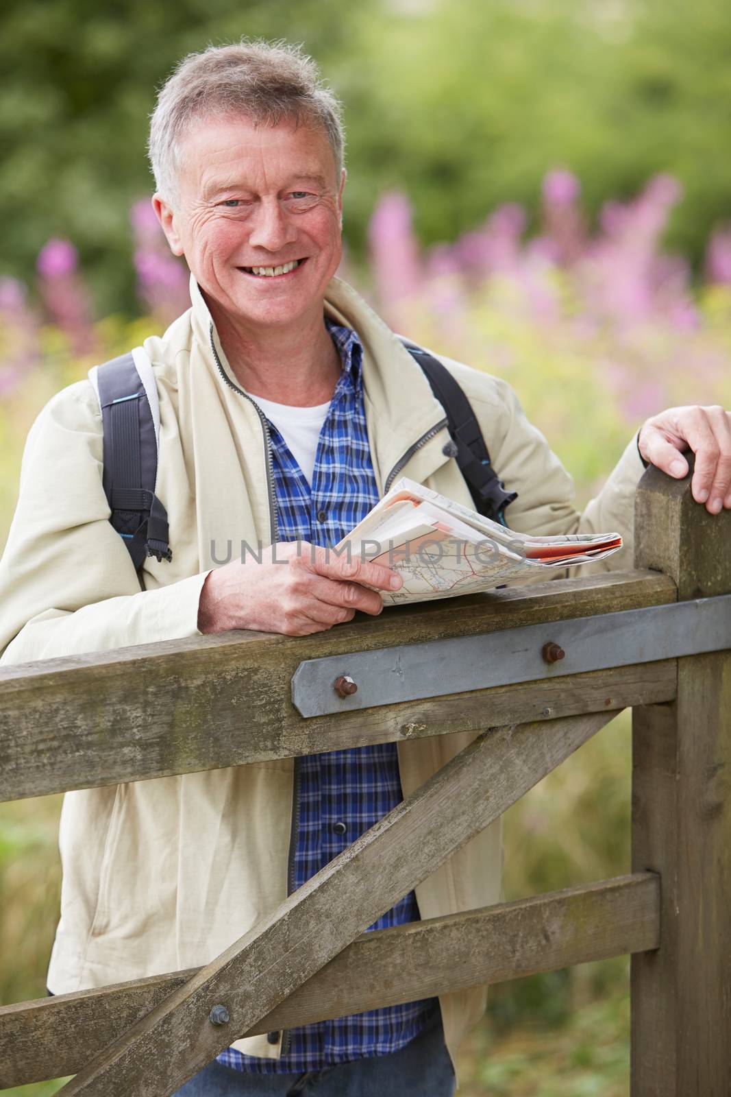 Senior Man Walking In The Countryside by HWS