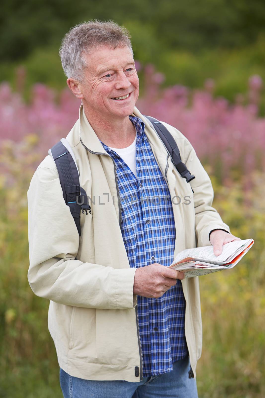 Senior Man Enjoying Hike In The Countryside