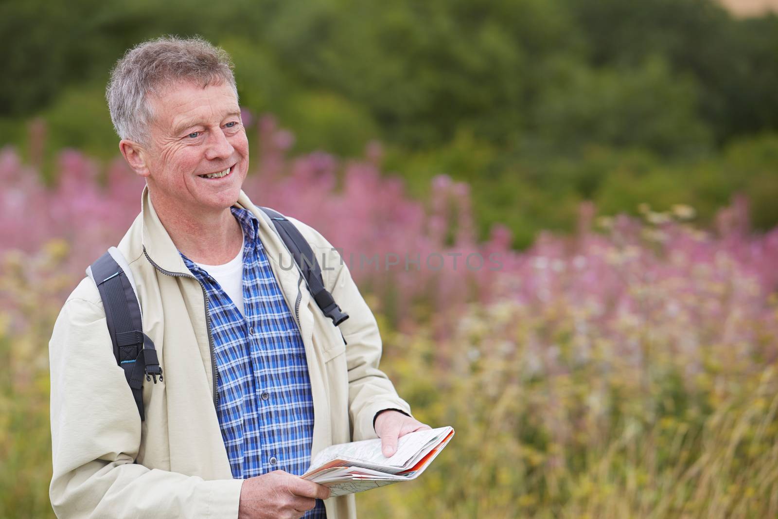 Senior Man Enjoying Hike In The Countryside by HWS