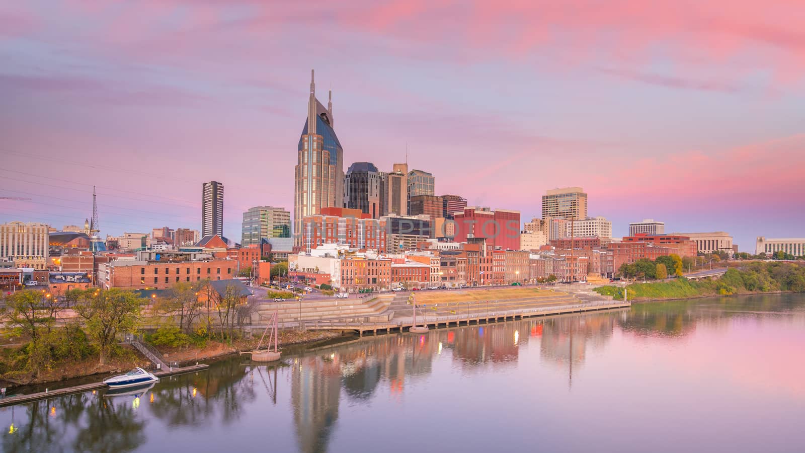 Nashville, Tennessee downtown skyline with Cumberland River in USA at sunset