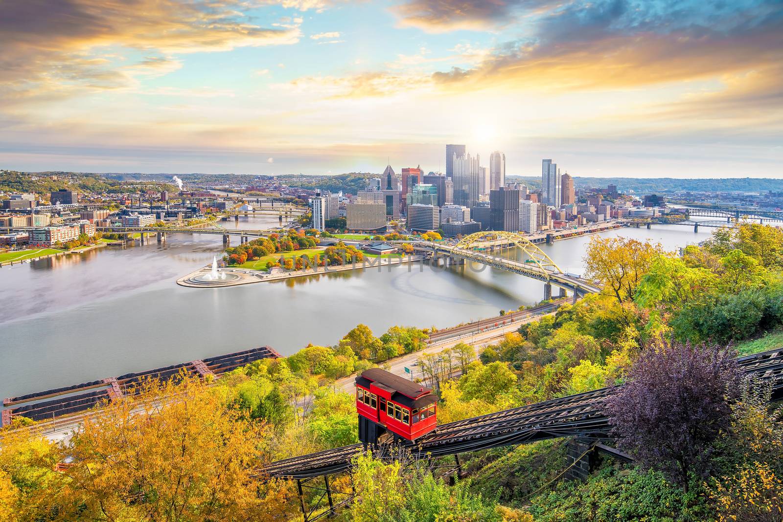 Downtown skyline and vintage incline in Pittsburgh, Pennsylvania, USA at sunset