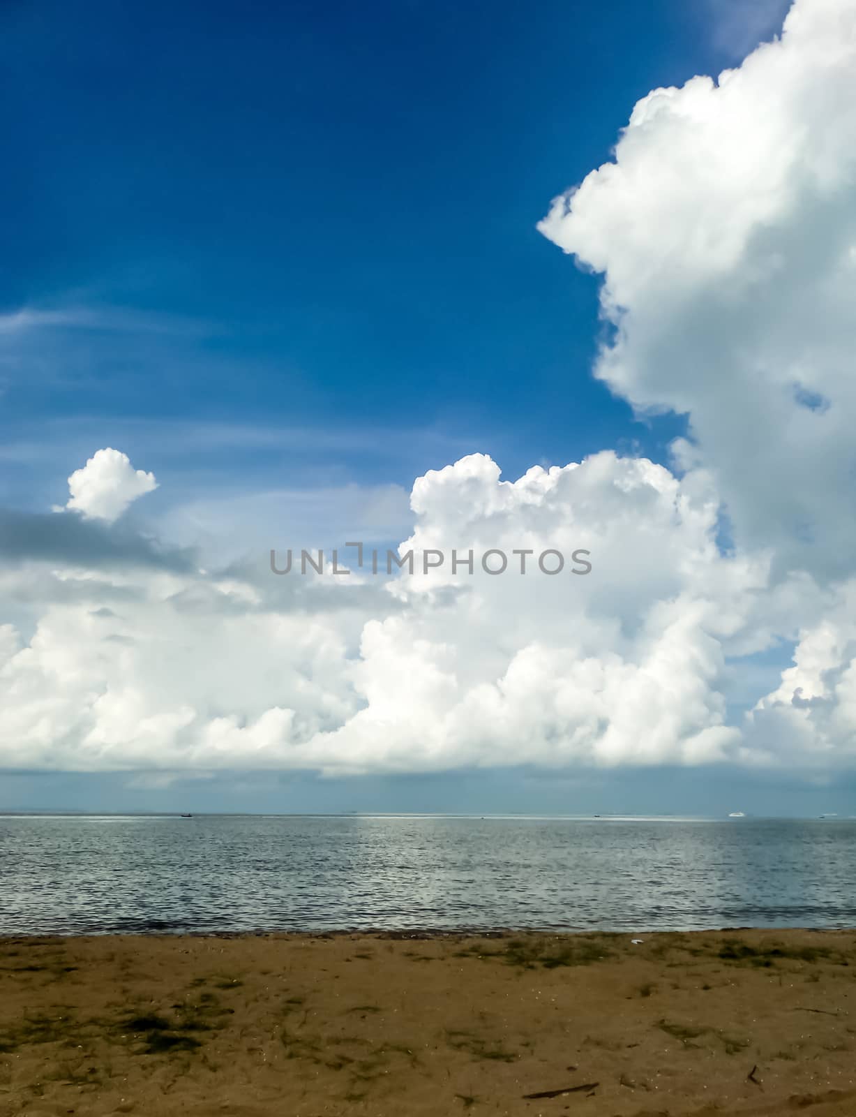 White cloud and the blue sky and sea sand beach