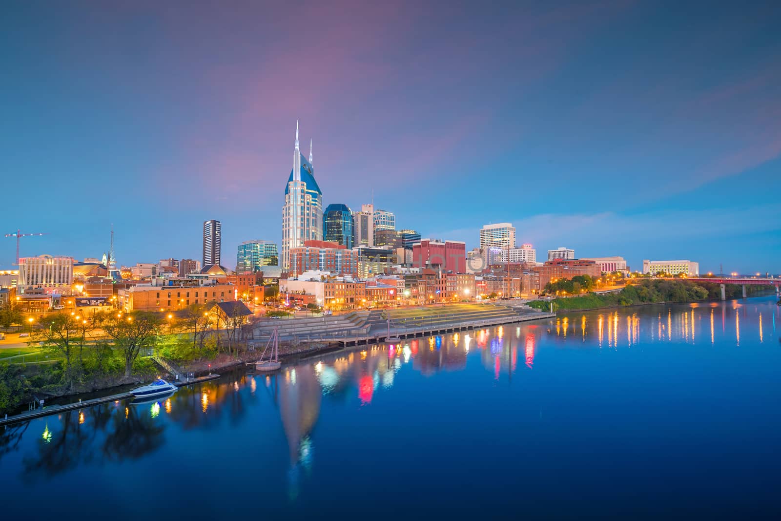 Nashville, Tennessee downtown skyline with Cumberland River in USA at sunset