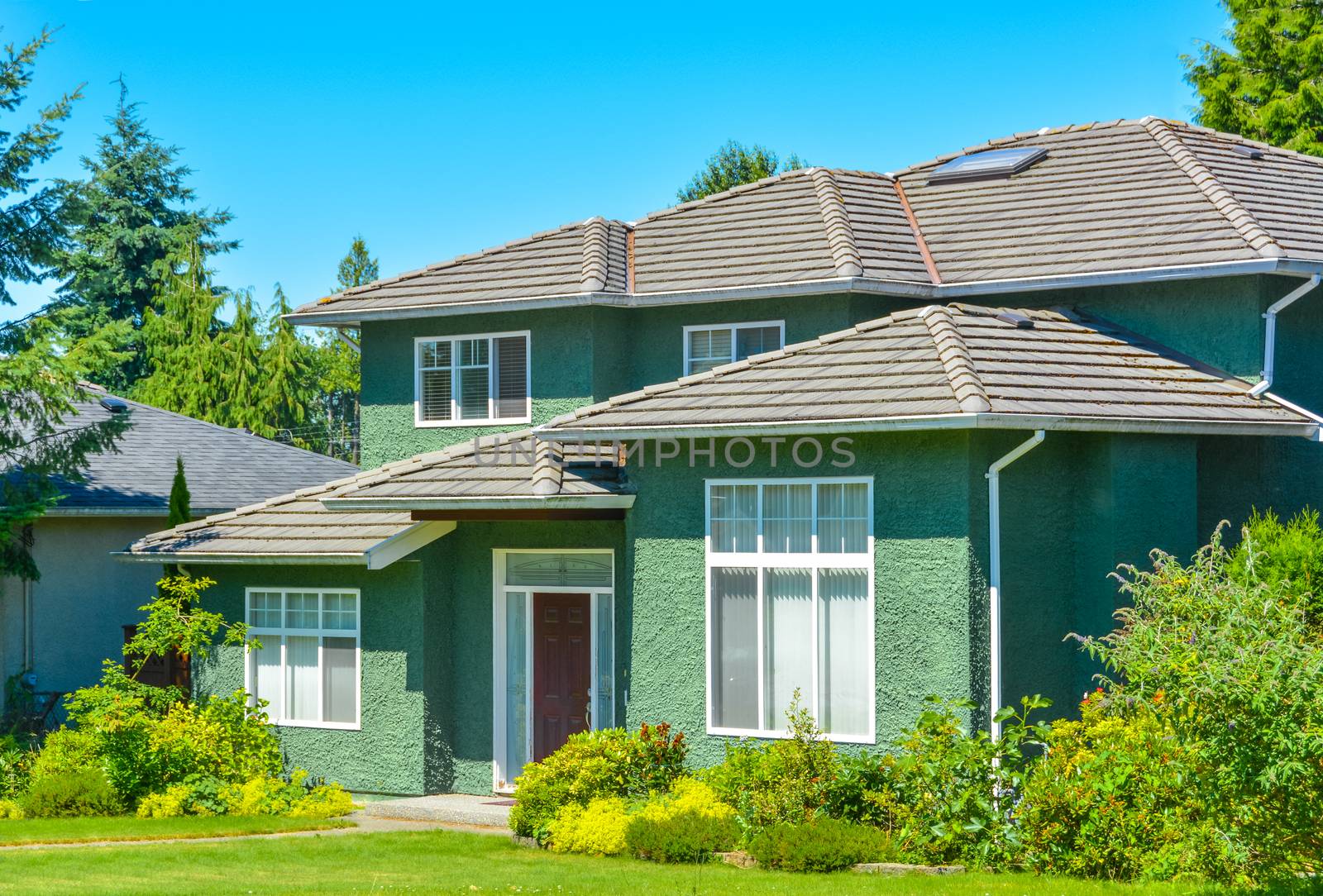 Green family house on a sunny day in Vancouver, Canada