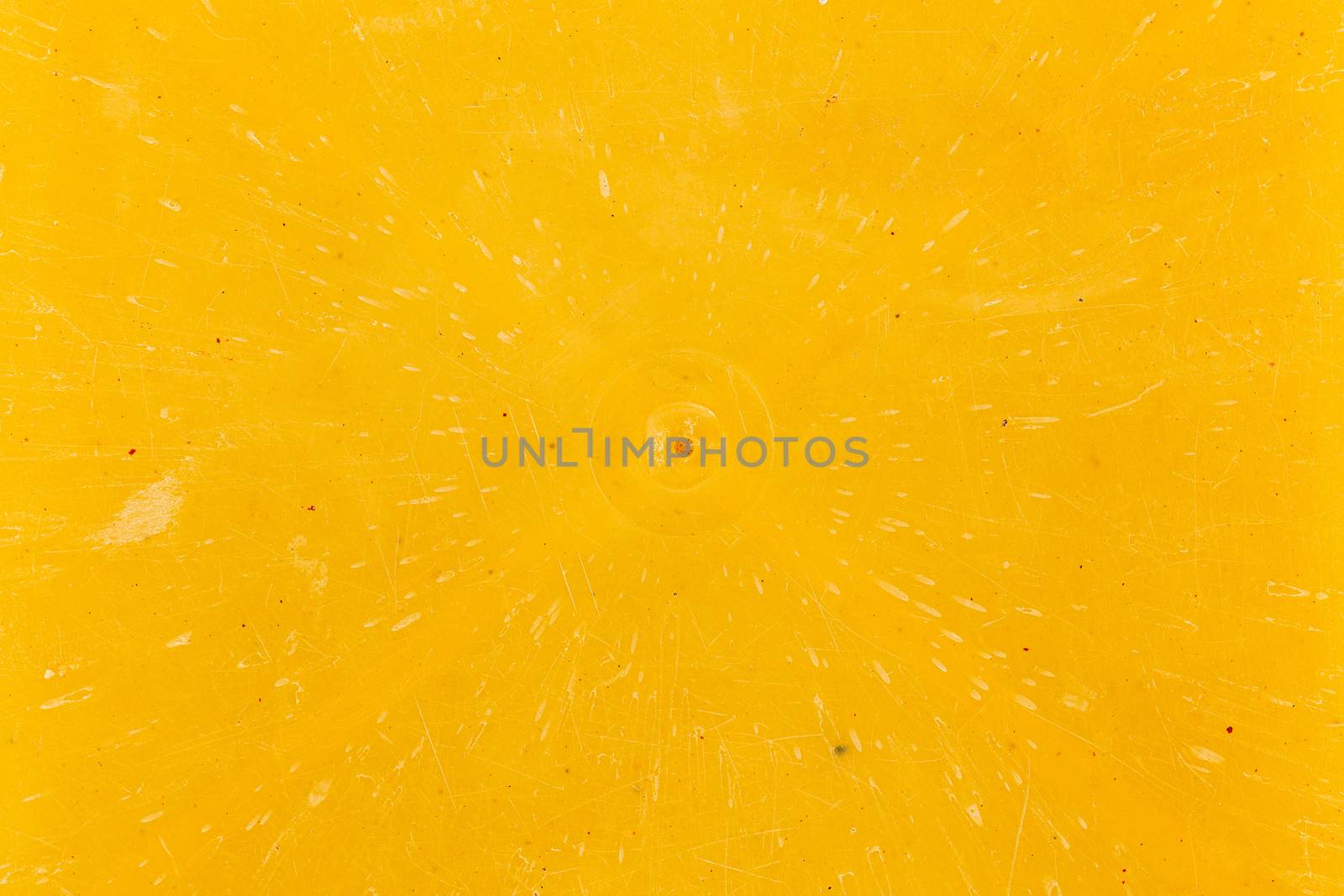 close-up flat texture and background of yellow bakelite or carbolite plastic material.