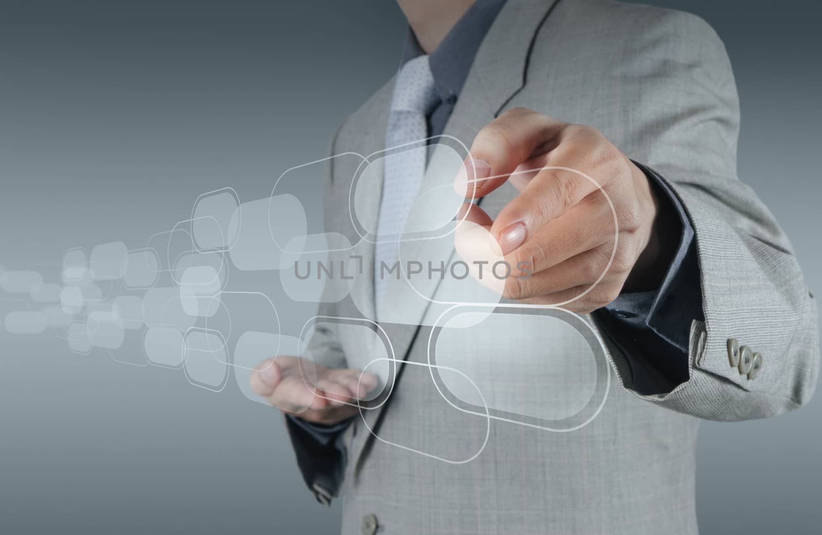 businessman shows modern technology by everythingpossible