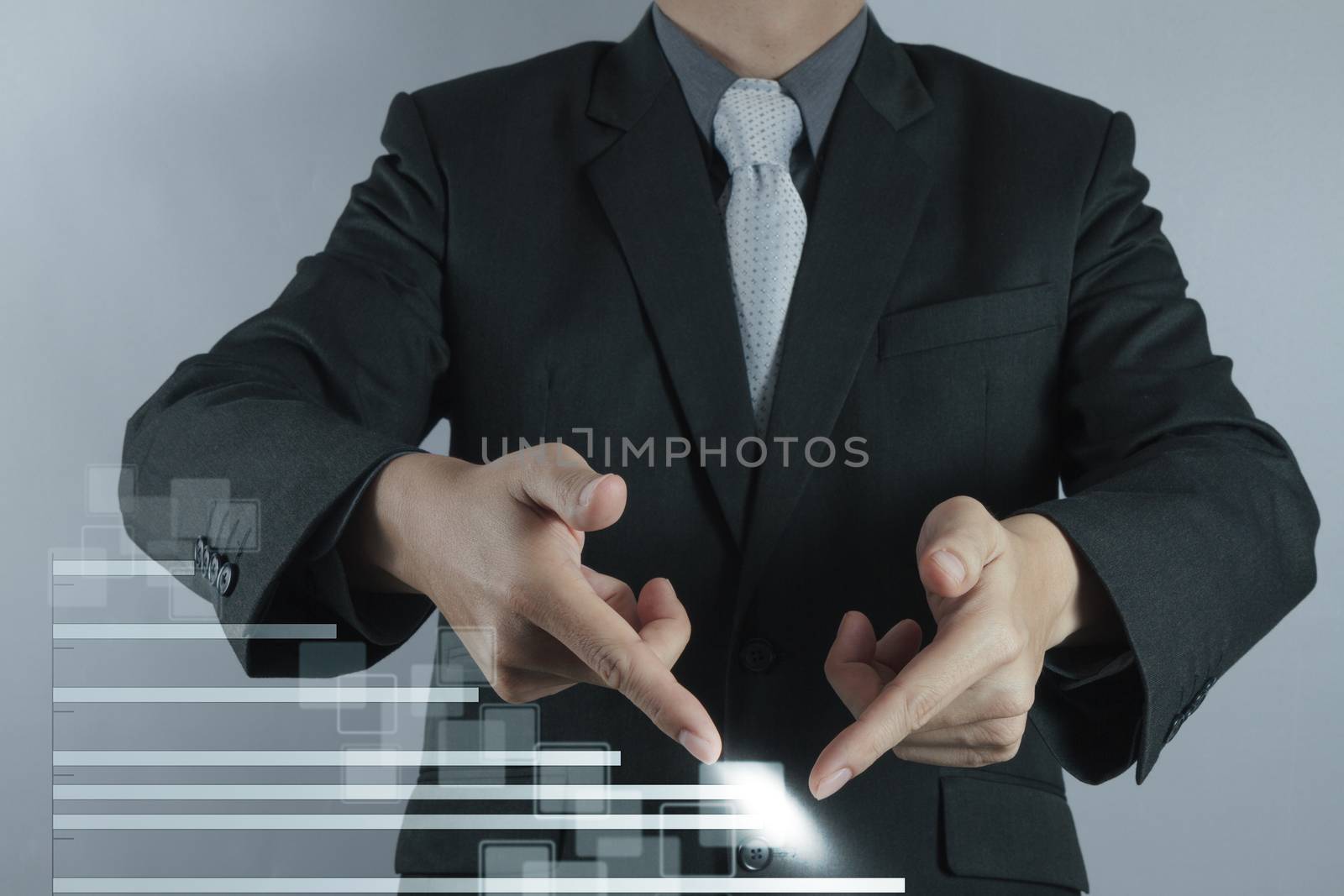 businessman hand drawing a pie chart and 3d graph