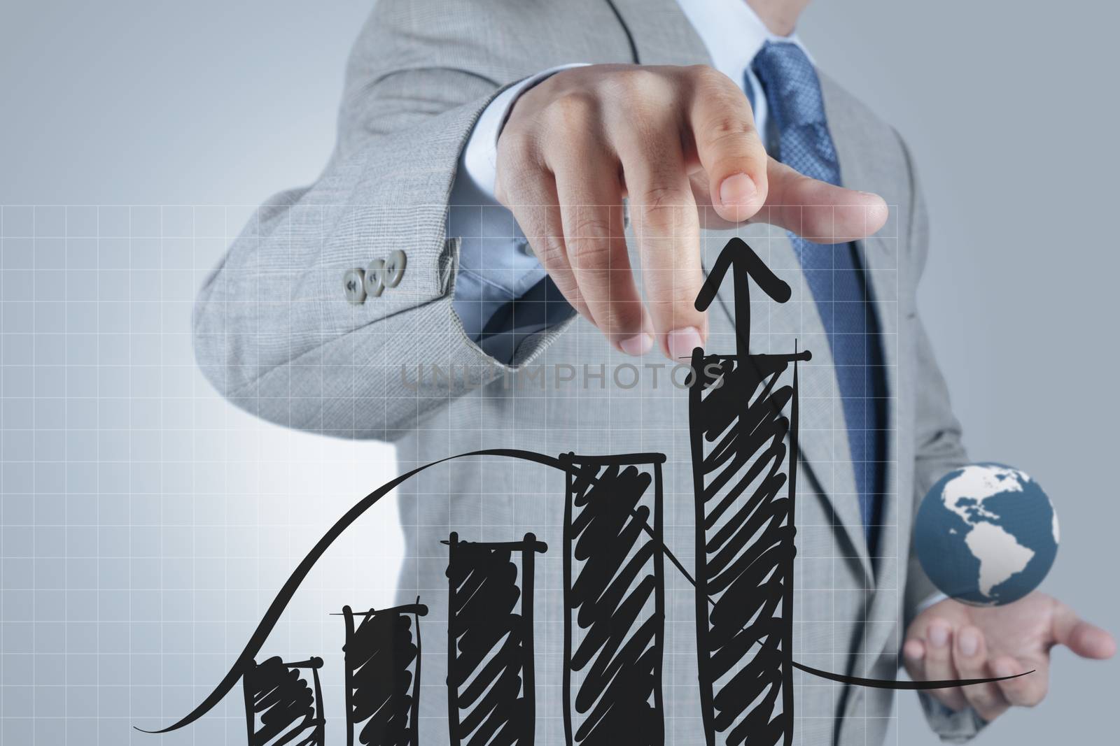 businessman hand drawing a pie chart and 3d graph