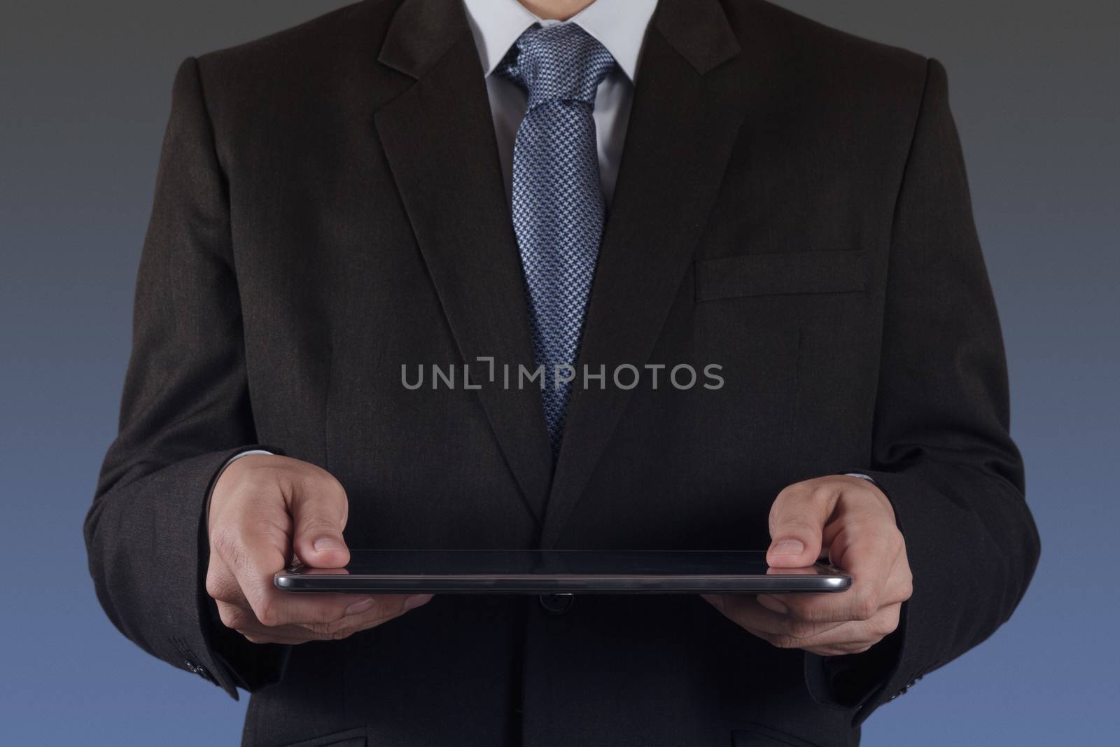businessman hand using tablet computer