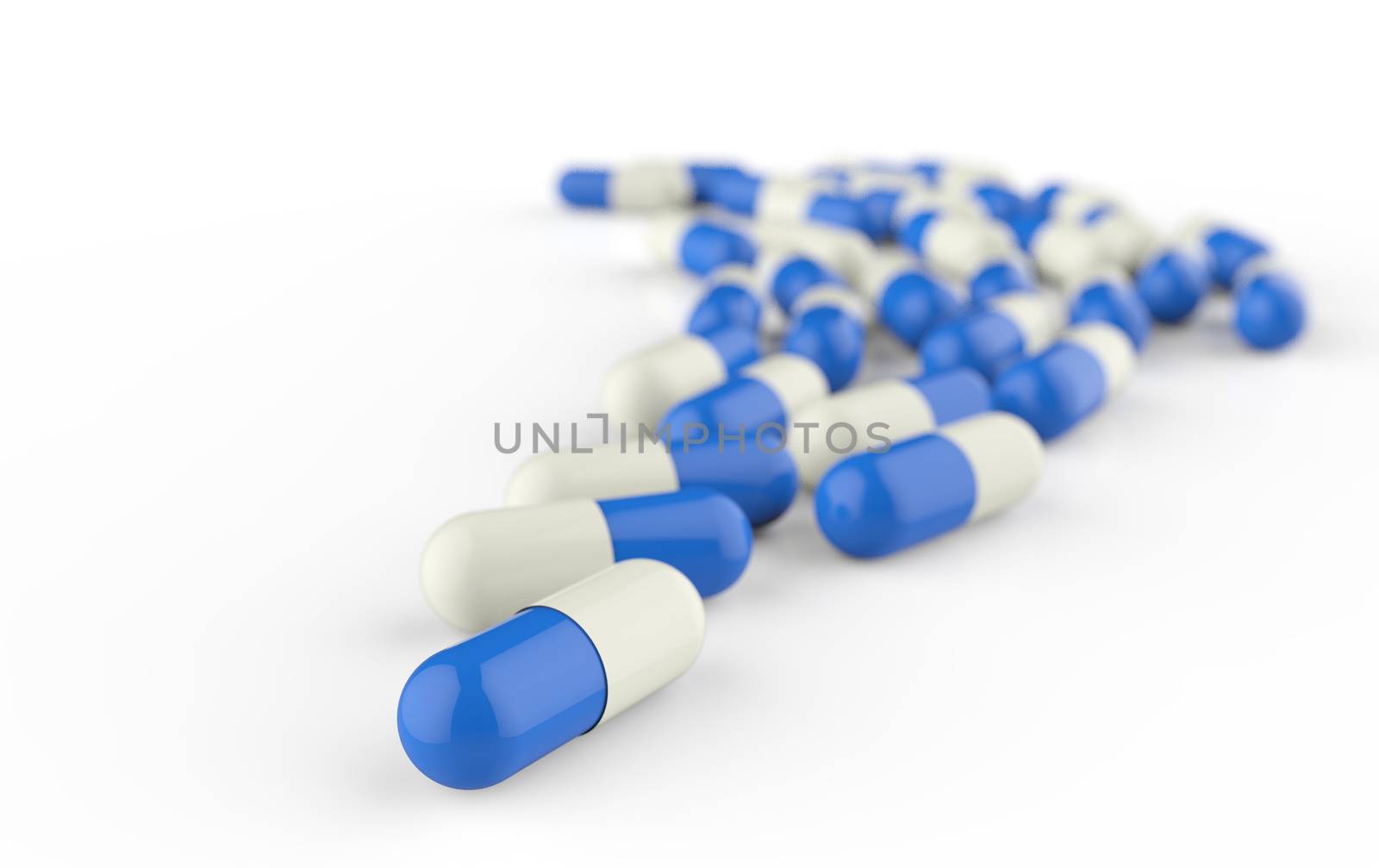 Pills spilling out of pill bottle isolated on white.