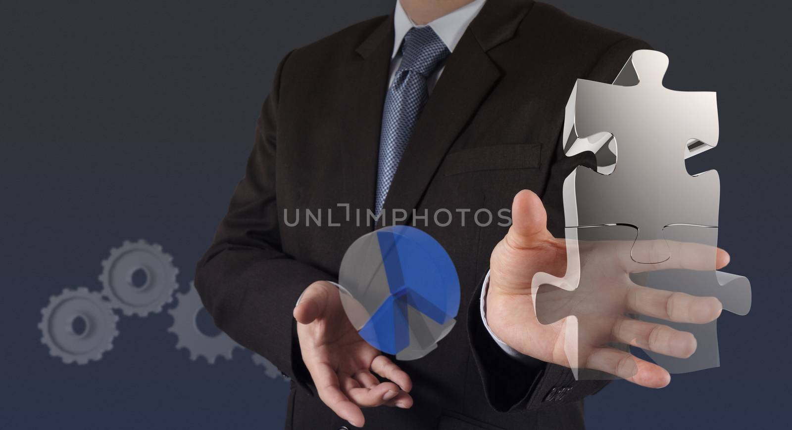 businessman hand shows light and puzzle partnership