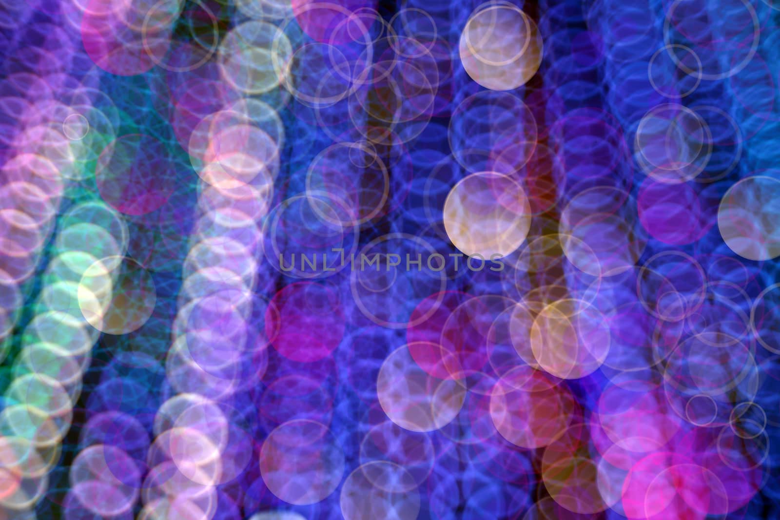 Abstract, defocused, blurred Christmas light background. Multicolor bokeh circle background (illumination garland decoration).