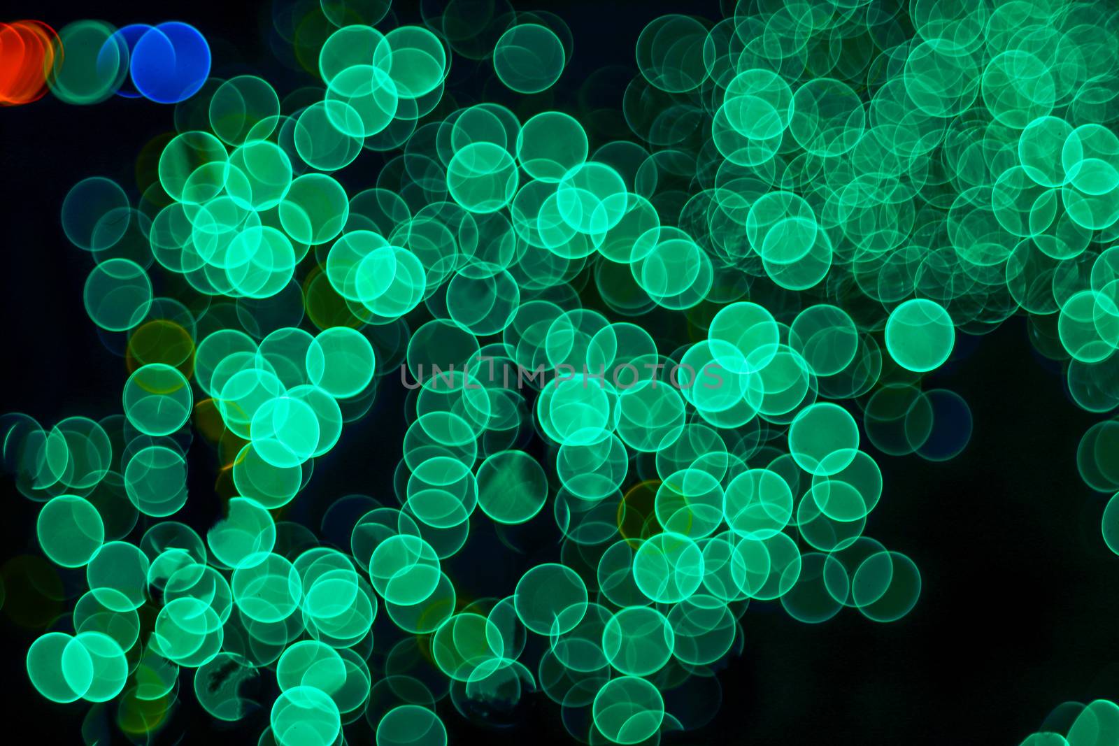 Classic bokeh “soap bubbles” Aqua Menthe. Festive Christmas elegant abstract background with booble bokeh lights. Background with defocused lights. Copy space.