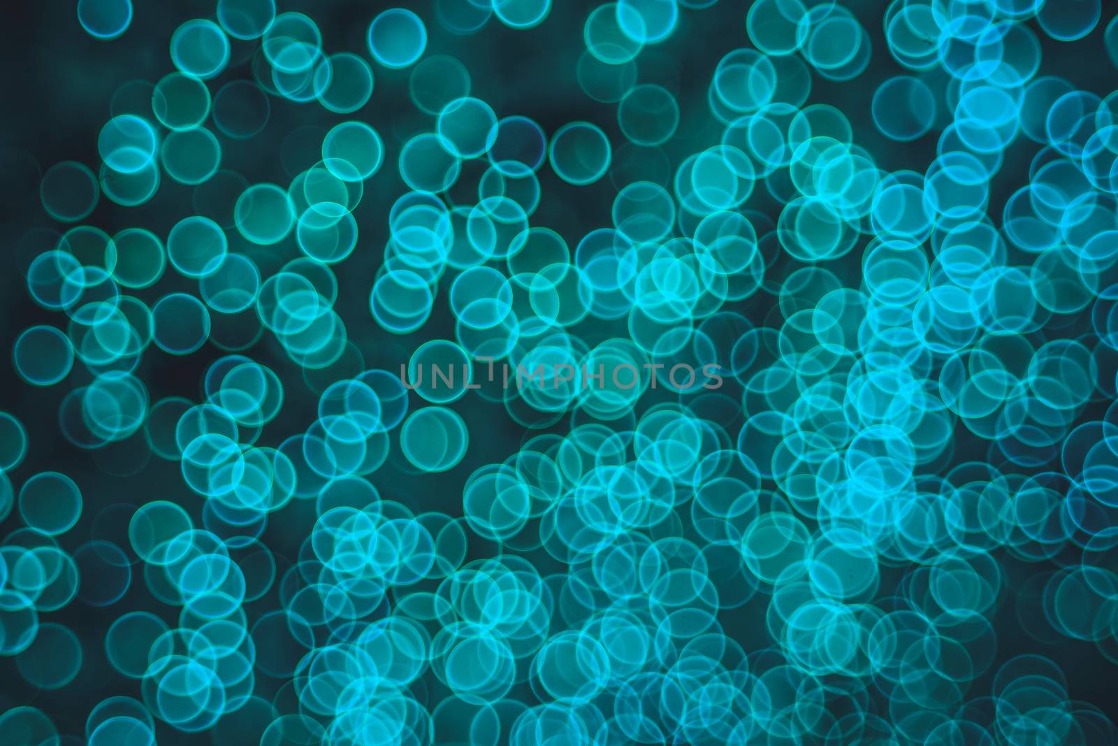 Classic bokeh “soap bubbles” Aqua Menthe. Festive elegant abstract background with booble bokeh lights. Background with defocused lights. Copy space.