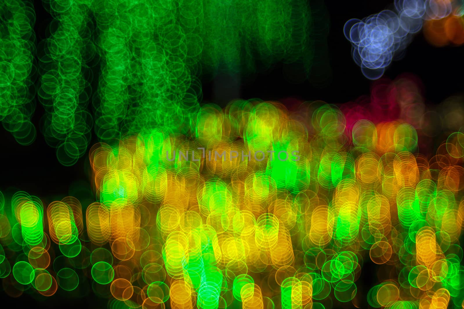 Festive abstract background with bubble bokeh defocused lights. Majestic tree of lights. Fantastic forest. Copy space.