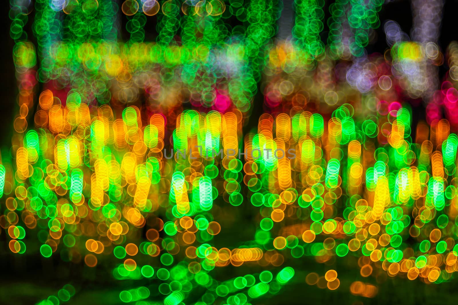 Festive abstract background with bubble bokeh defocused lights. Majestic tree of lights. Fantastic forest. Copy space.