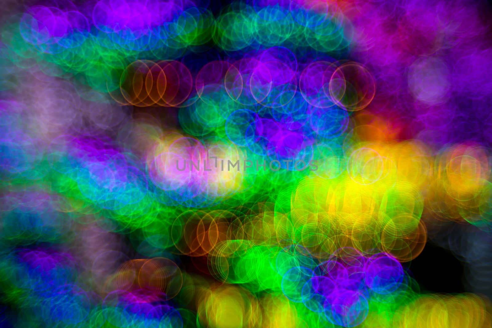 Background of abstract bubble bokeh lights. Natural defocused photo. Christmas light blurred, abstract background. Neon color. Copy space.