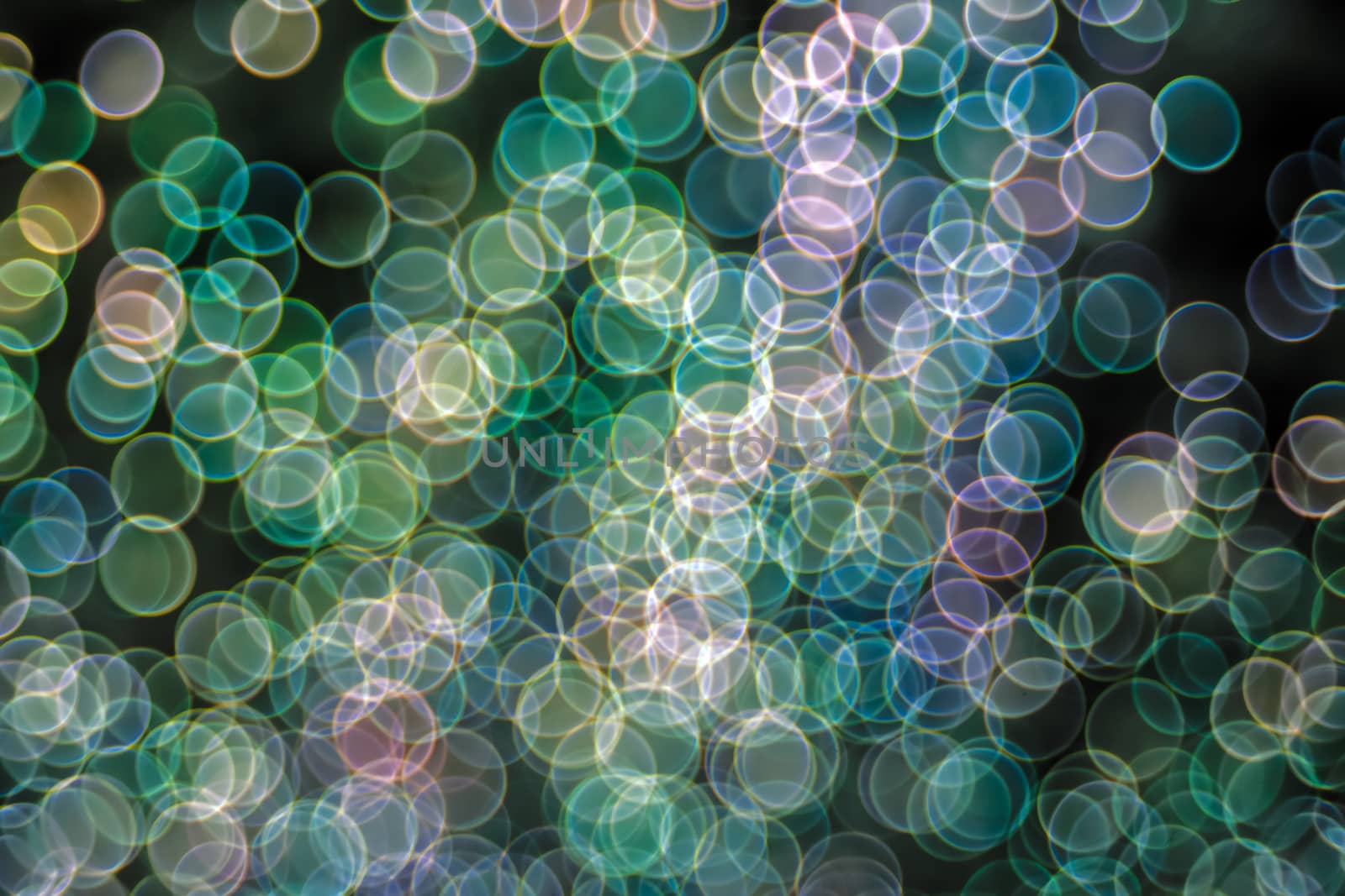Festive Christmas elegant abstract background with booble bokeh multicolored lights. Background with defocused lights. Classic bokeh .Copy space.