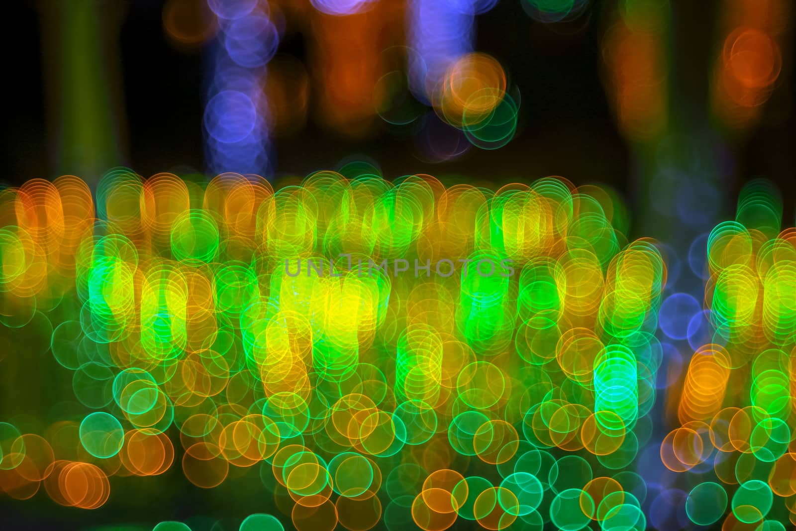 Abstract twinkled bright background with defocused lights. Majestic tree of lights. Fantastic forest. Background with bubble bokeh lights. 