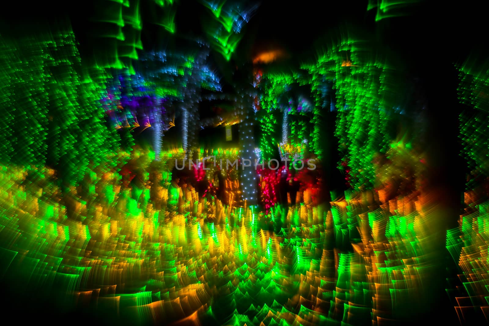 Abstract background fantastic forest with unic defocused lights. Millions of brilliant lights. Twinkling lights. Unique bokeh effect.