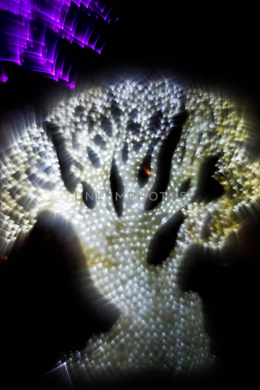 Abstract twinkled bright background with defocused lights. Majestic tree of lights. Fantastic forest. Unique bokeh effect.