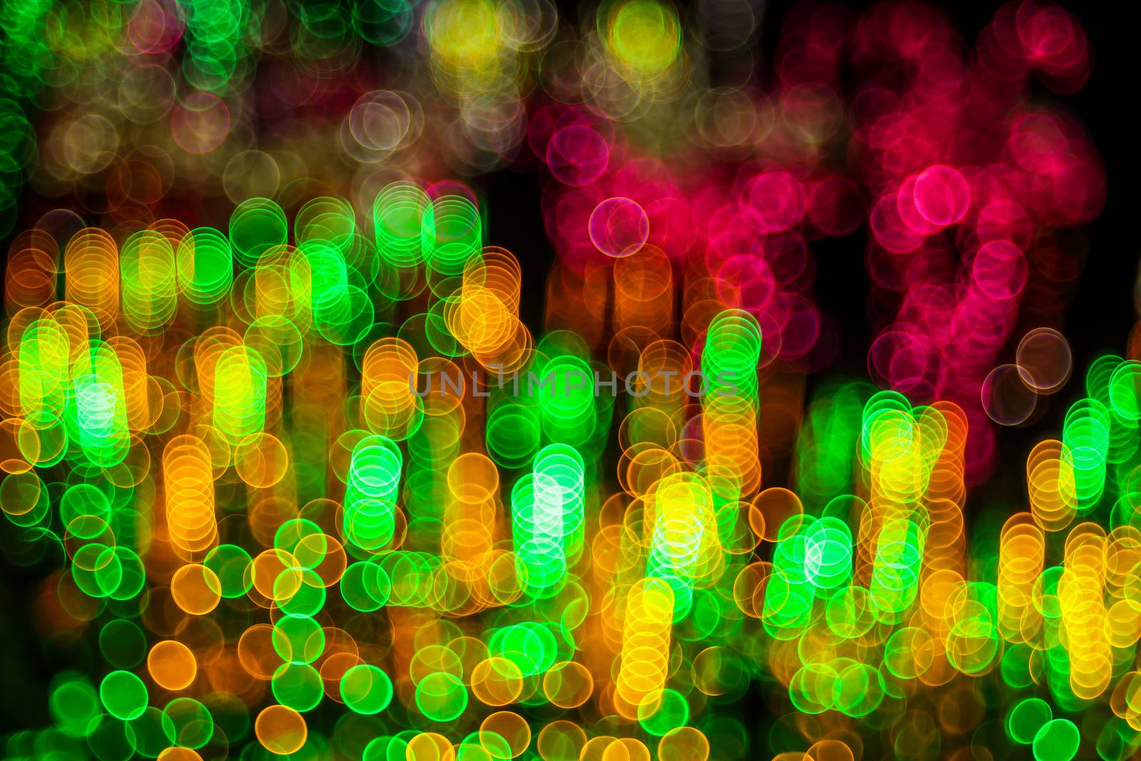 Abstract background fantastic forest with unic defocused lights. Millions of brilliant lights. Twinkling lights. Unique bokeh effect.