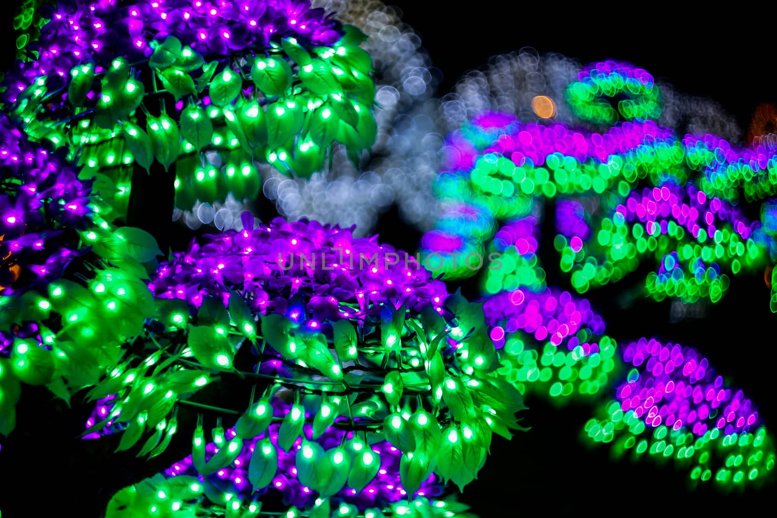 Abstract background with bubble bokeh defocused lights. Majestic tree of lights. Fantastic forest. Copy space. 