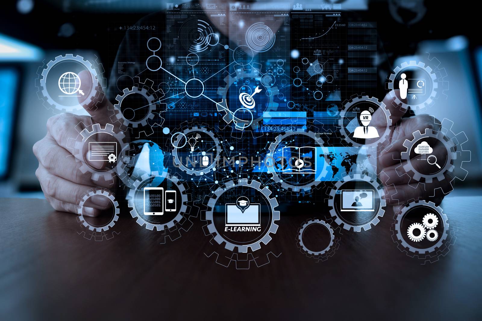 E-learning with connected gear cogs connected diagram virtual dashboard.Businessman hand using mobile phone with digital layer effect as business strategy concept                 