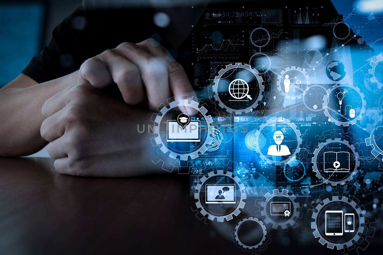 E-learning with connected gear cogs connected diagram virtual dashboard.Businessman hand using mobile phone with digital layer effect as business strategy concept                 