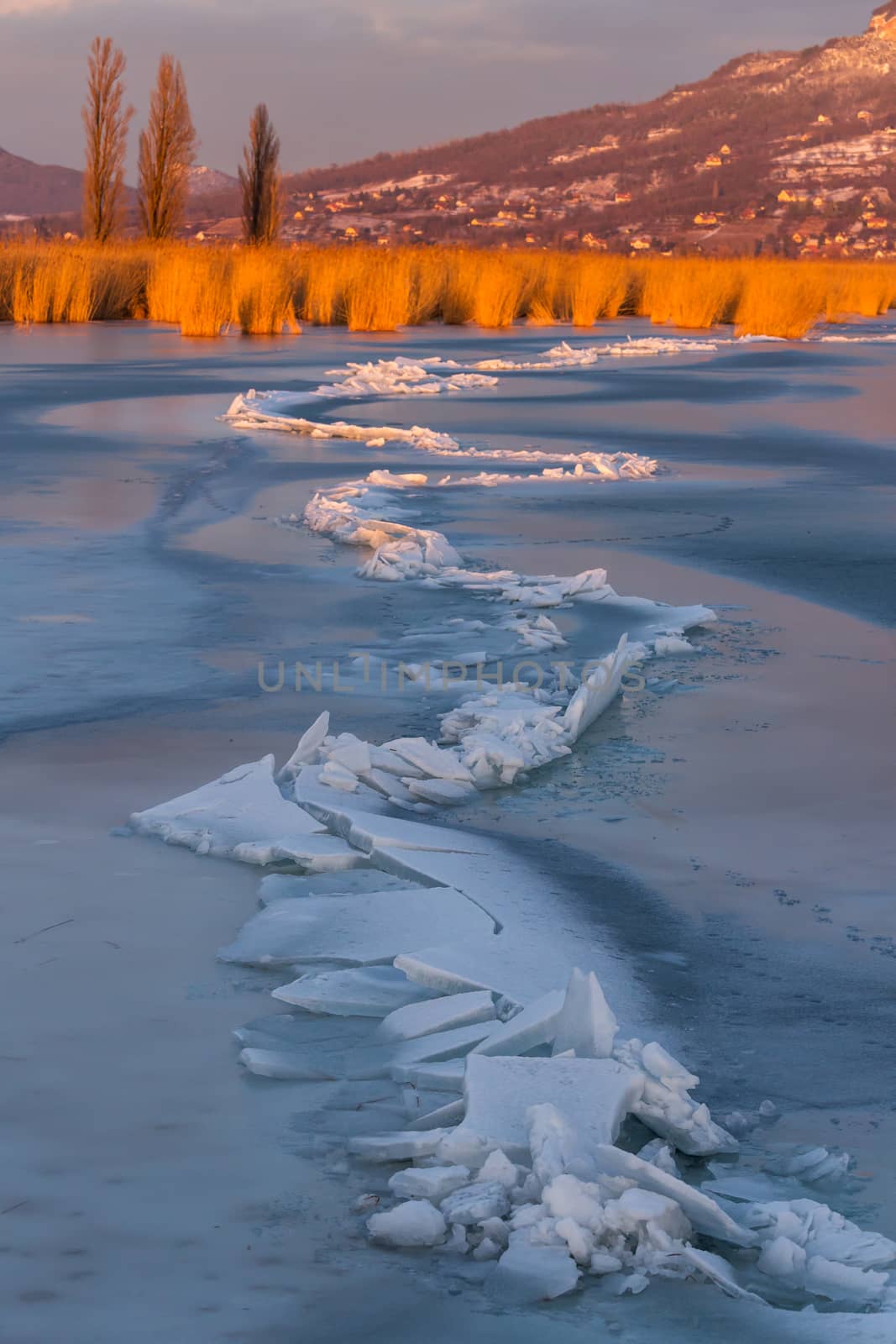 A lot of iceblocks on each other in Lake Balaton on the sunset light