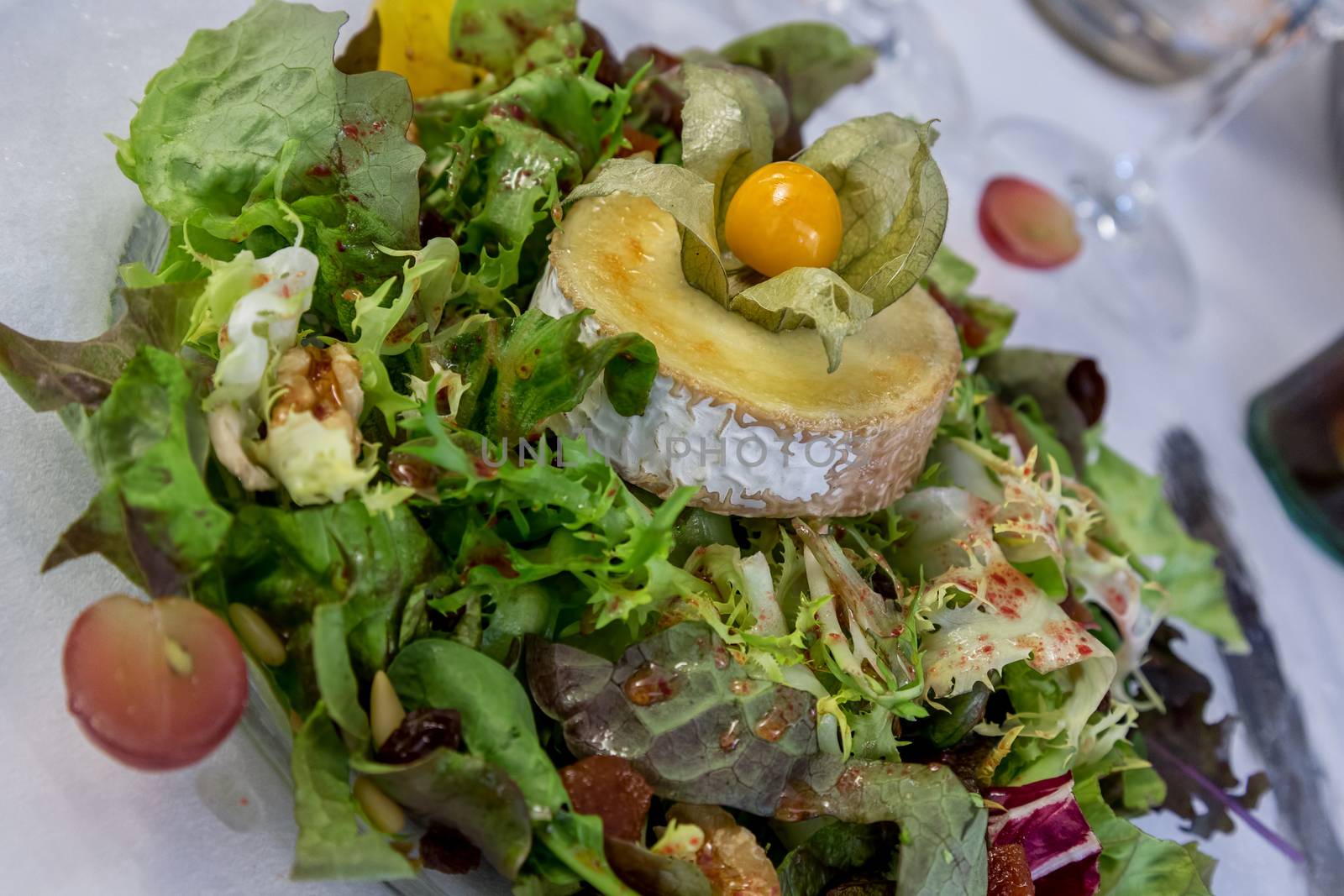 Salad with goat cheese in the restaurant by Digoarpi
