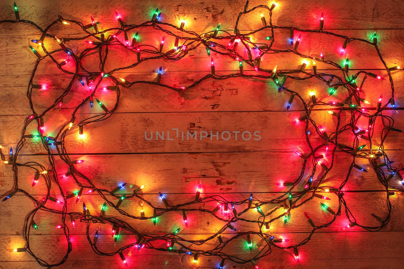 Christmas background with lights and free text space. Christmas lights frame. Garland. Flat lay, top view, copy space. Horizontal shot. 
