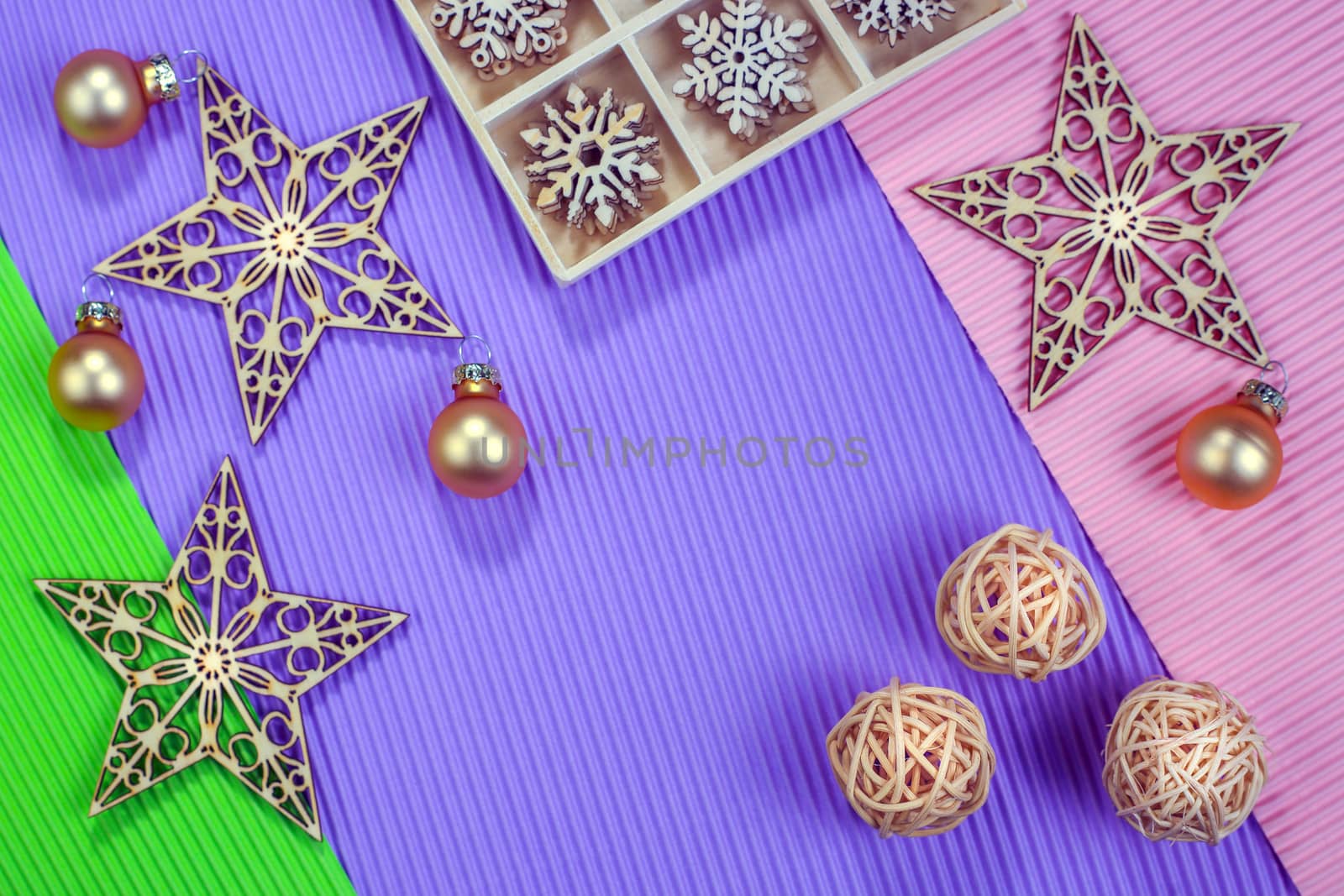 Composition of the Christmas decorations on color paper background. Christmas, winter, New Year concept. Flat lay, top view, copy space.