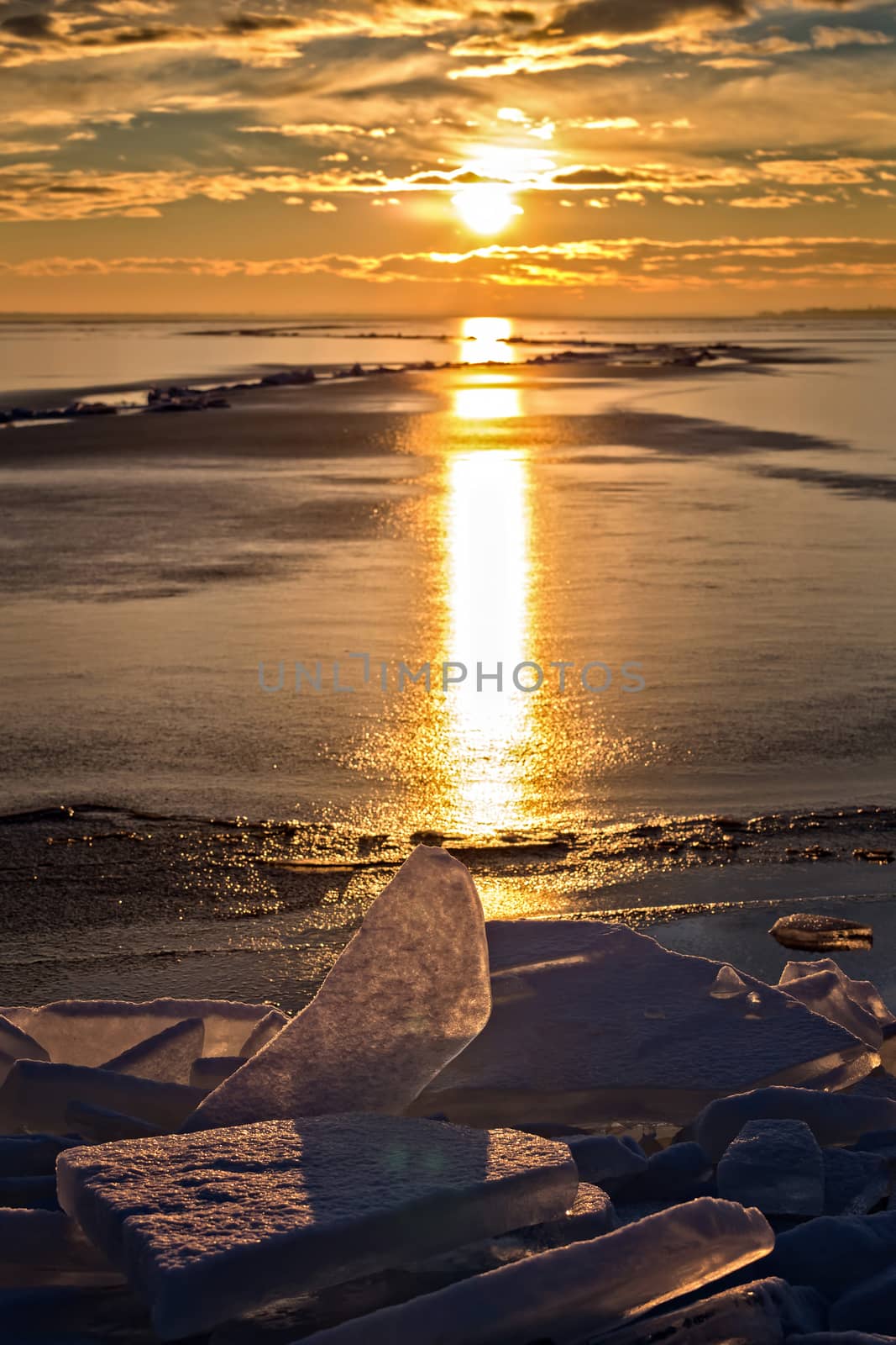 A lot of iceblocks on each other in Lake Balaton on the sunset l by Digoarpi