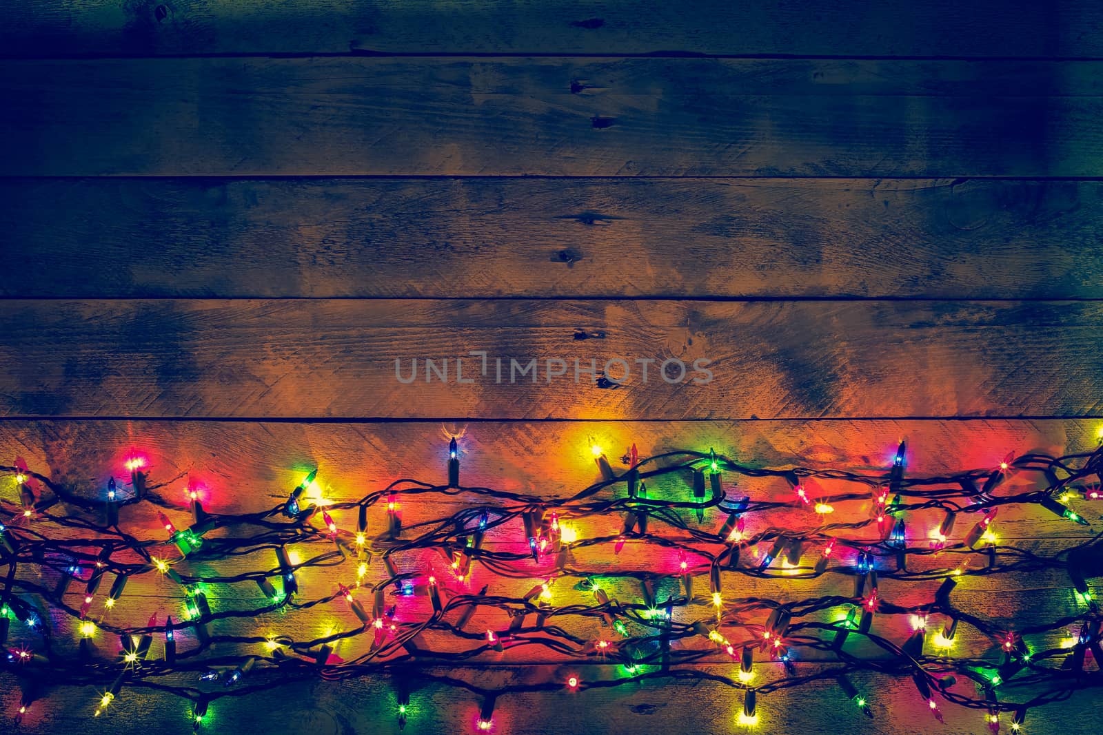 Colorful Christmas garland warm lights. Multicolored light lines by BarisevRoman