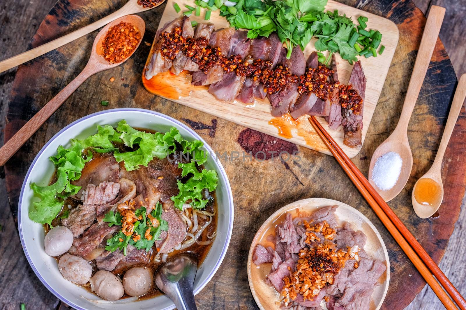 Thai food Noodle soup with beef on wood background