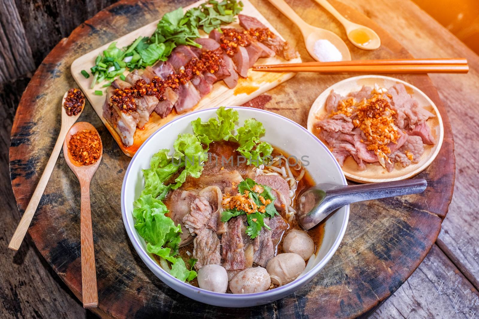 Thai food Noodle soup with beef on wood background