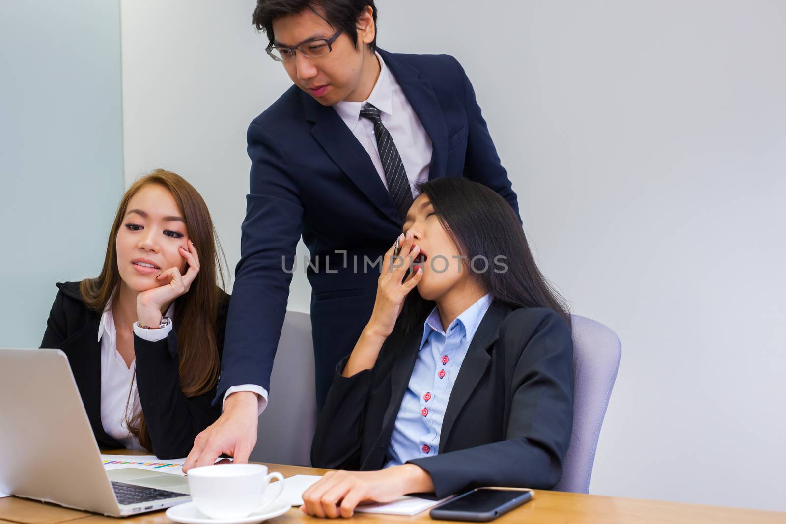 Asian business people make a group discussion in meeting room by pattierstock