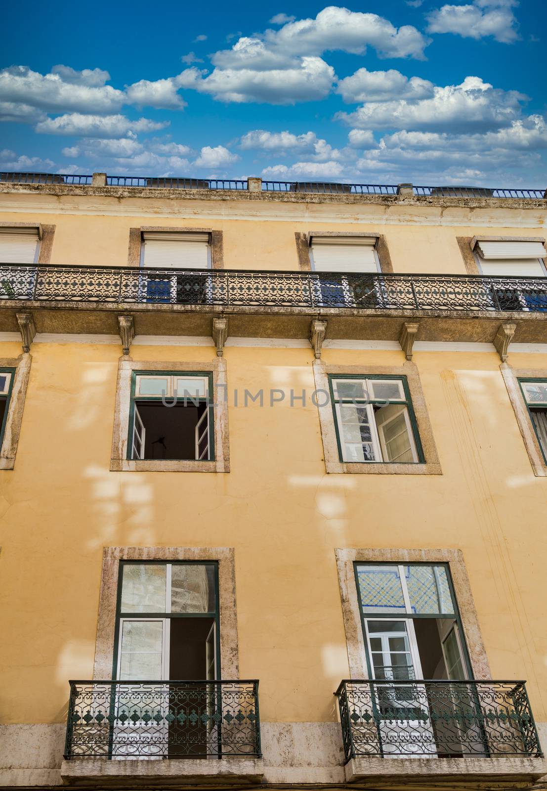 Two French Balconies on Plaster Apartment in Lisbon