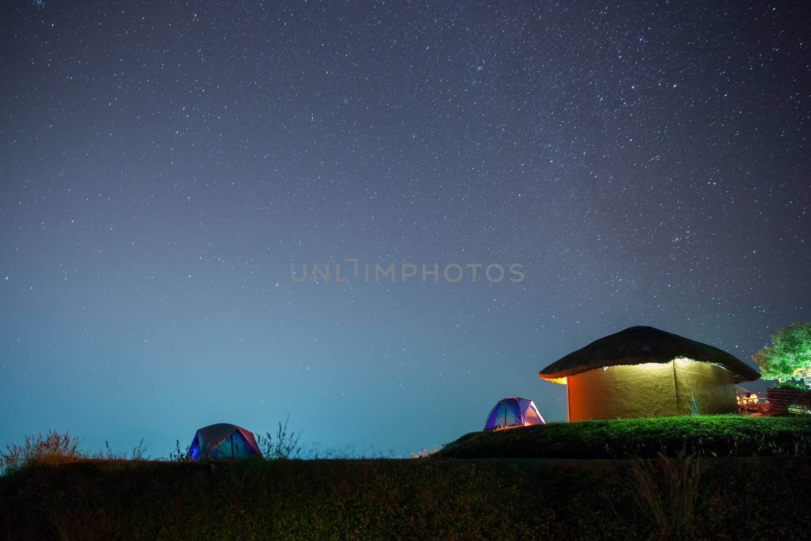 Milkyway and star with camping tent at night time