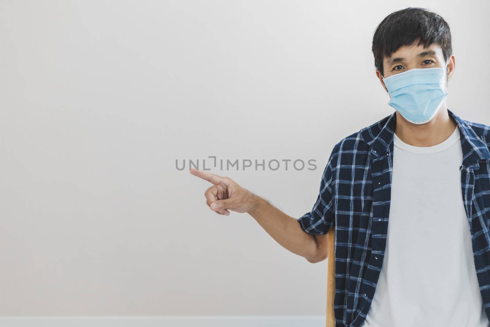 Asian man business wear surgical mask creative working online work from home and  shopping online payment price e-commerce shopping online in home lifestyle to new normol