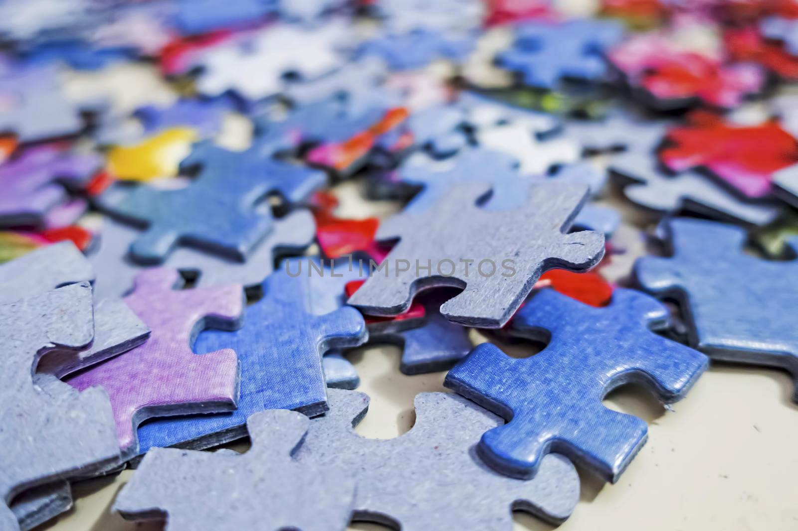 close up jigsaw puzzle pieces on background