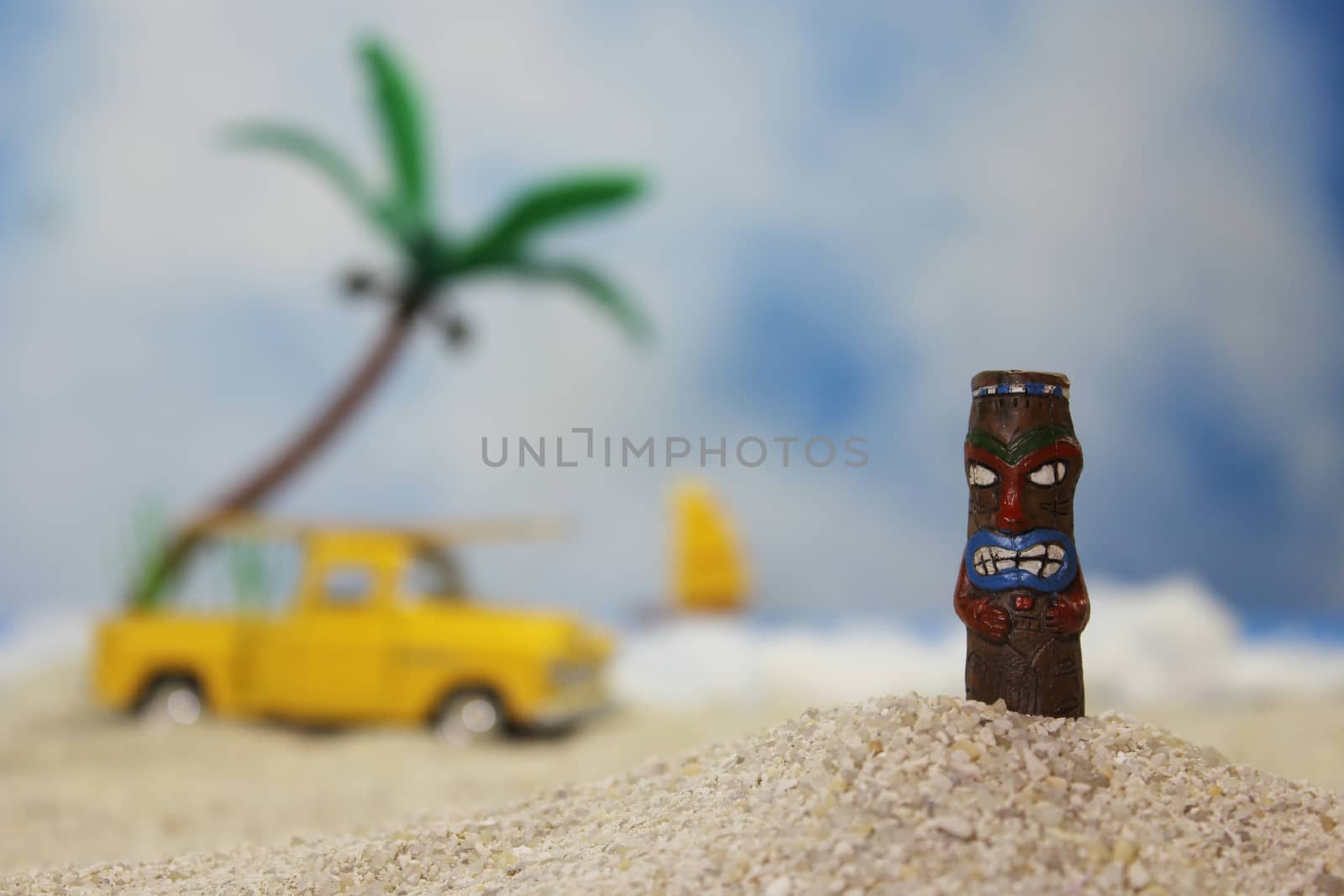 Tikki Statue on Tropical Beach with bright sunlight