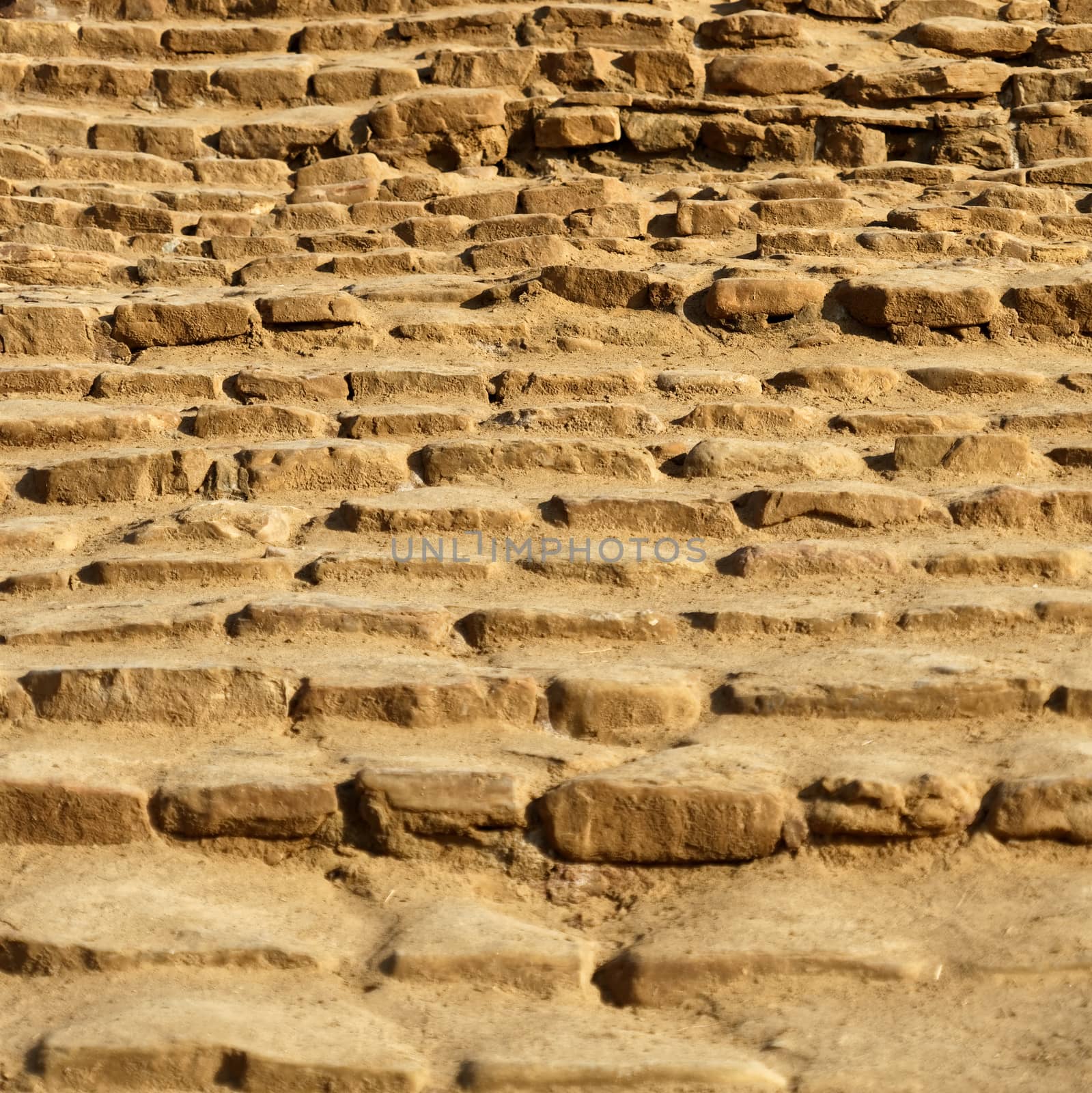 Stairs with treads of single hewn sandstone blocks leading to the beach of Amman at the Dead Sea, Jordan