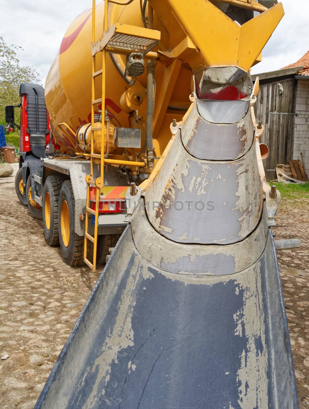 Direct view of the empty and clean ramp of a concrete mixer on a construction site, Germany