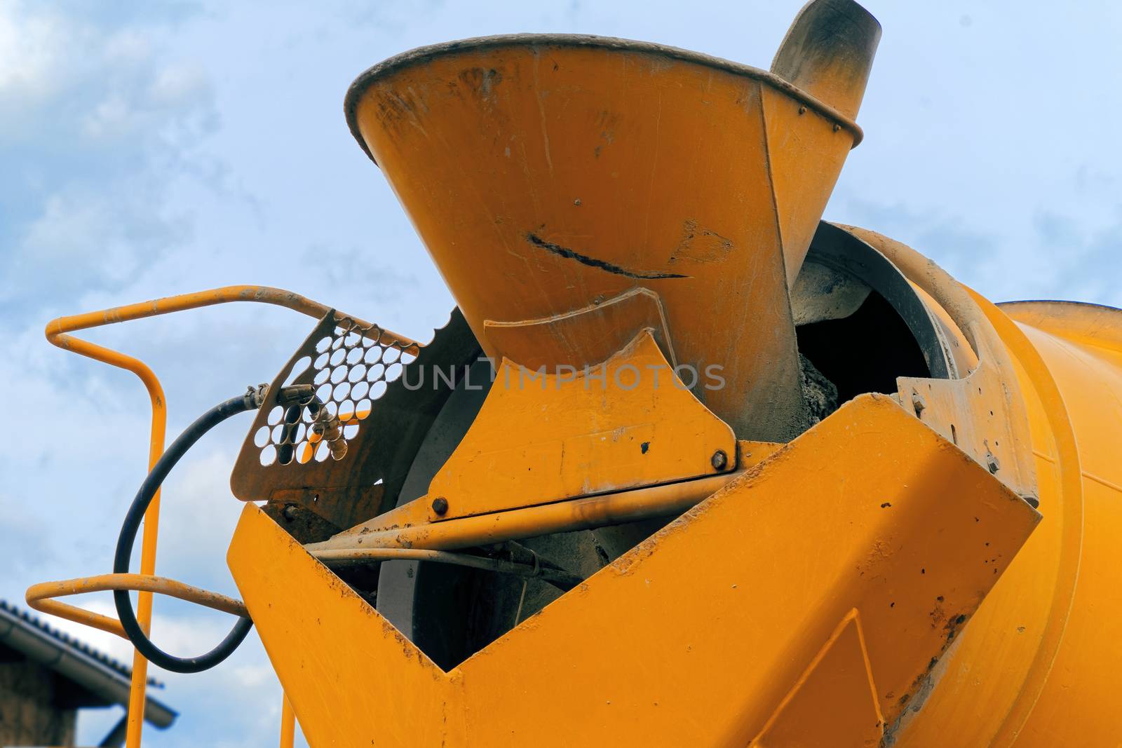 Close-up of the rear part of a concrete mixer with the filling funnel for the liquid concrete by geogif