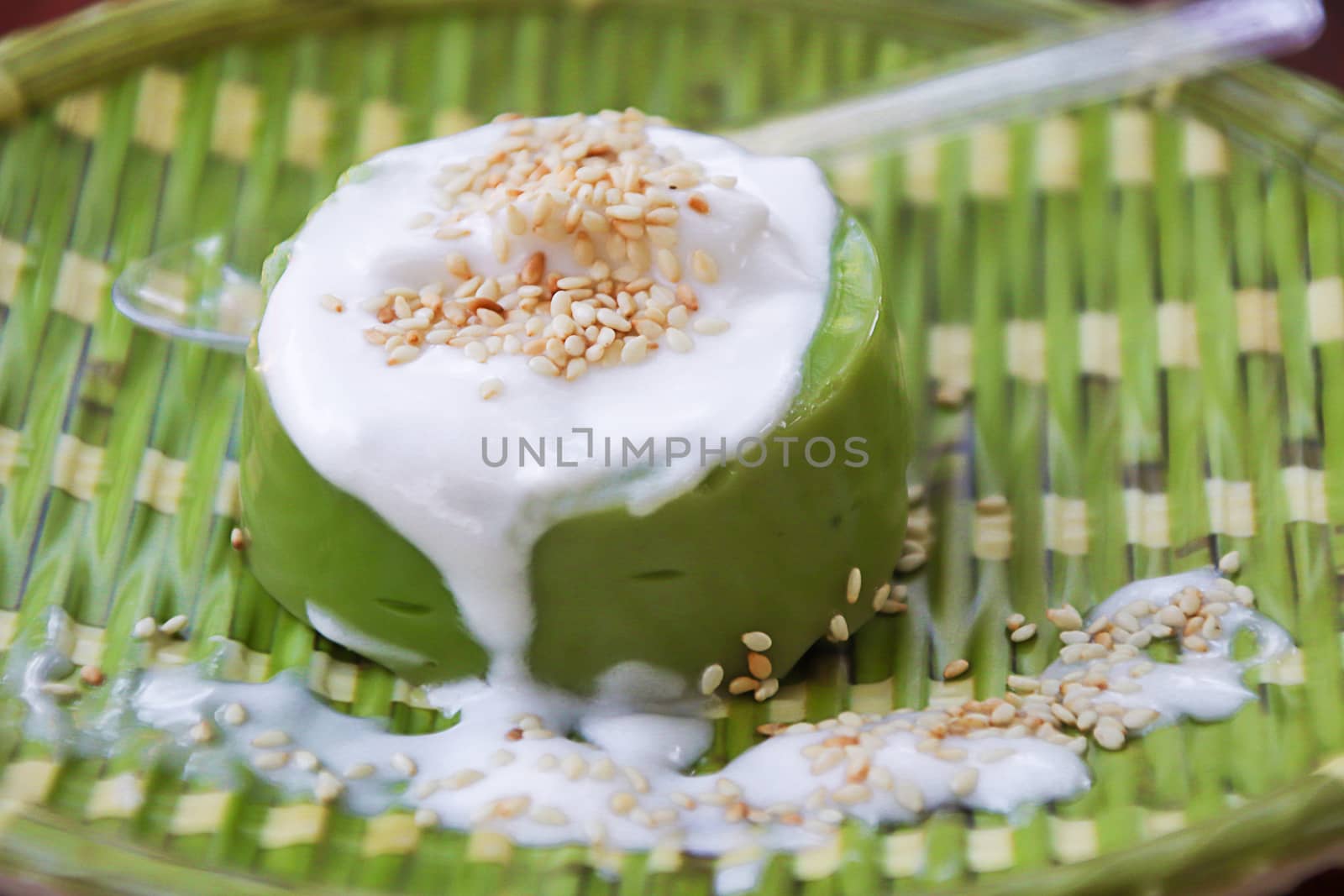Pandanus Pudding in Sweet Coconut Cream, traditional Thai desserts decorated in modern style, with a Thai name called Ka-nom piak-poon.