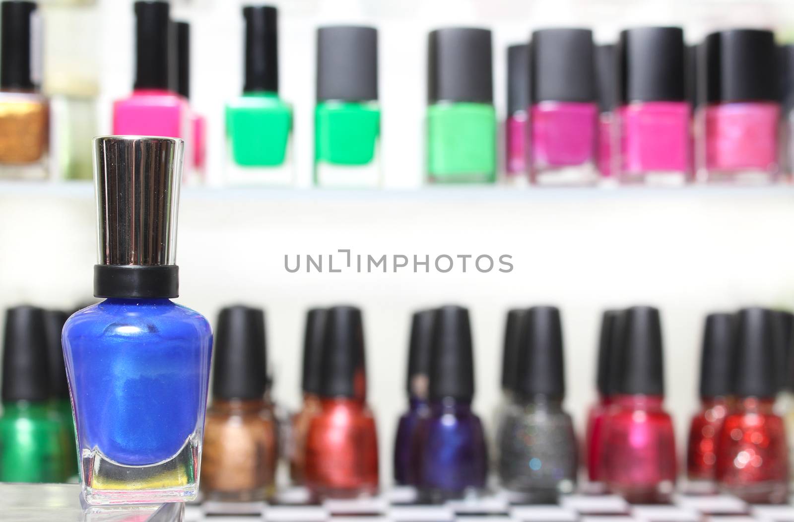 Nail Polish With Blurred Nail Polish Display in Background by Marti157900
